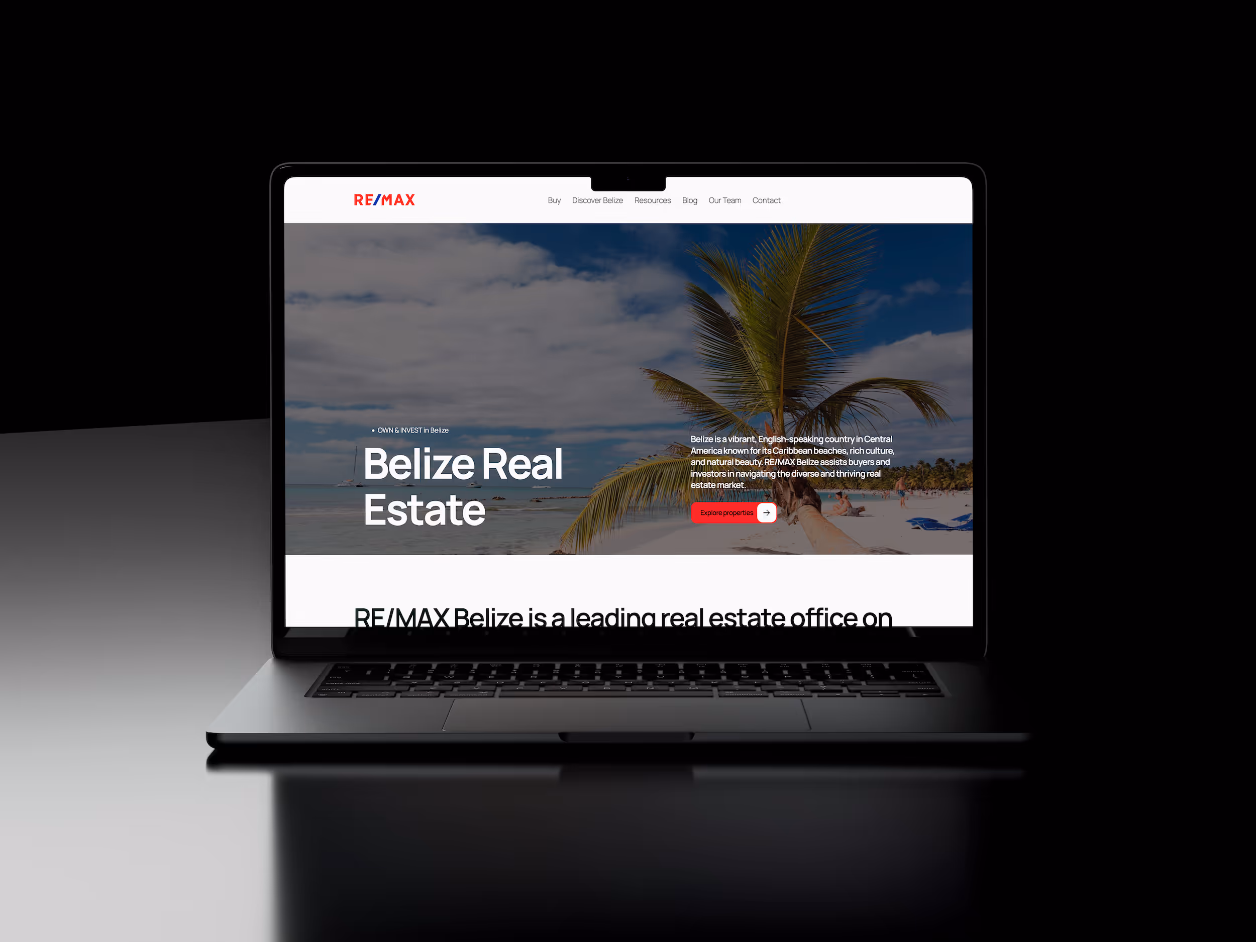 REMAX Belize real estate website displayed on a laptop